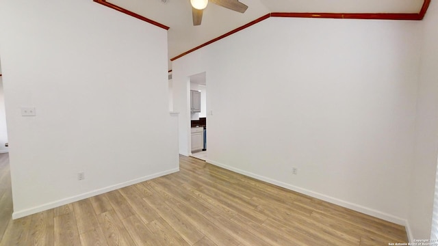 empty room with vaulted ceiling, ceiling fan, and light wood-type flooring