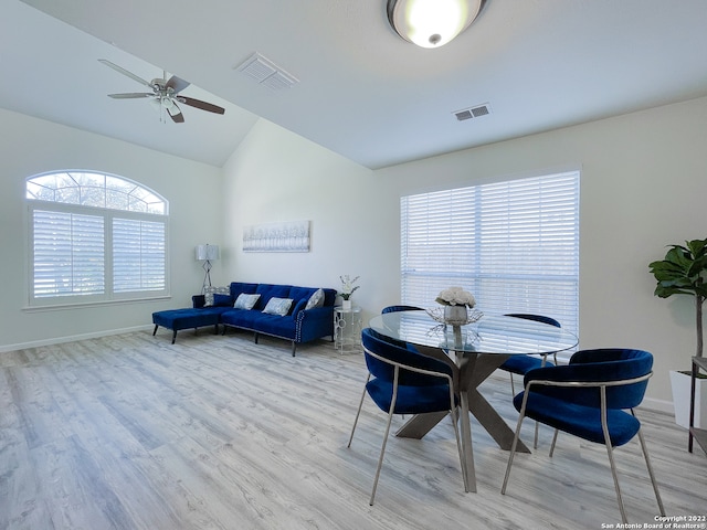 dining room featuring ceiling fan, a healthy amount of sunlight, and light wood-type flooring