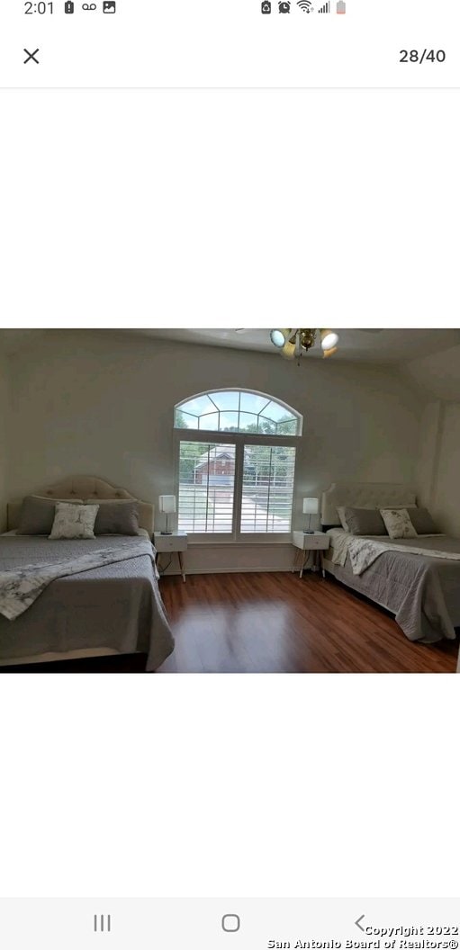 bedroom with hardwood / wood-style floors