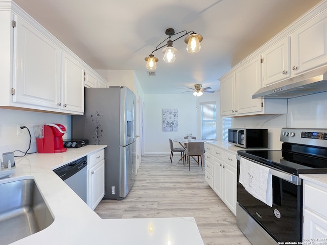 kitchen featuring appliances with stainless steel finishes, white cabinets, light wood-type flooring, and ceiling fan