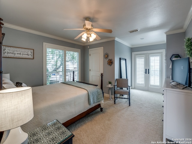 bedroom featuring multiple windows, ceiling fan, and ornamental molding