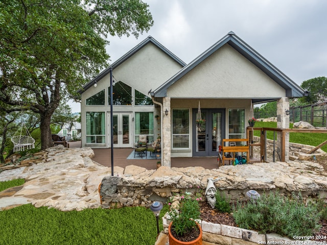 rear view of property featuring french doors