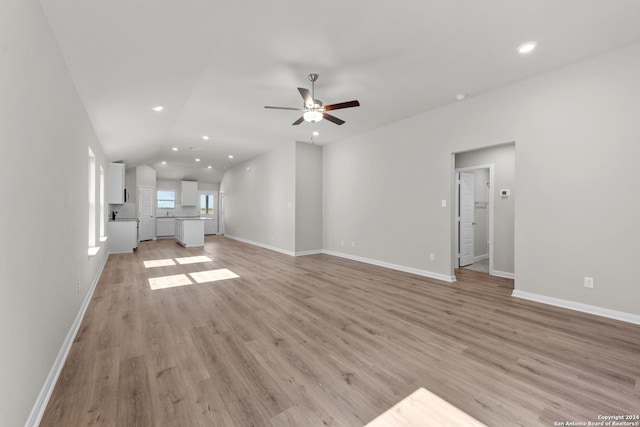 unfurnished living room featuring light hardwood / wood-style floors and ceiling fan