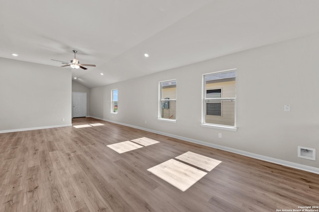 unfurnished living room with ceiling fan, light hardwood / wood-style floors, and lofted ceiling