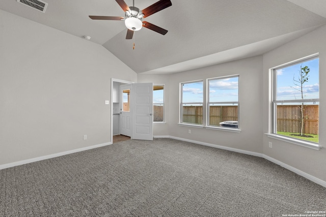 unfurnished bedroom featuring carpet flooring, ceiling fan, and lofted ceiling