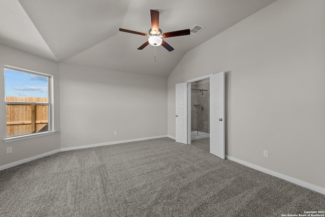 unfurnished bedroom with connected bathroom, ceiling fan, carpet, and lofted ceiling