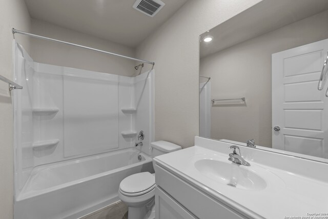 full bathroom featuring bathing tub / shower combination, tile patterned floors, vanity, and toilet