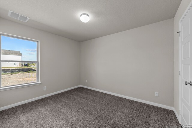 empty room featuring carpet floors