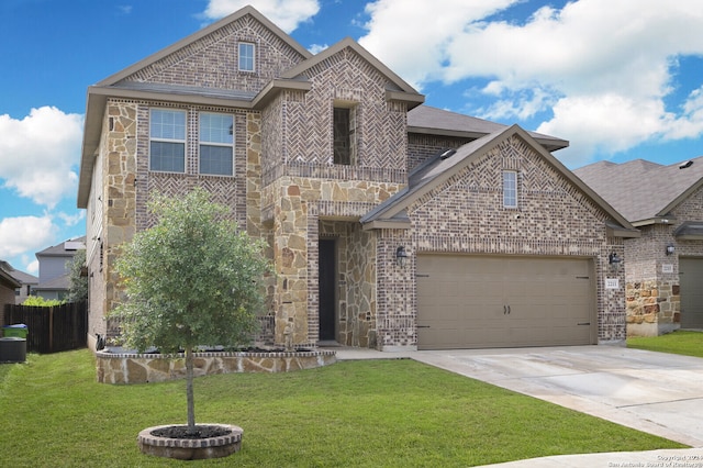 view of front of home featuring a garage and a front yard