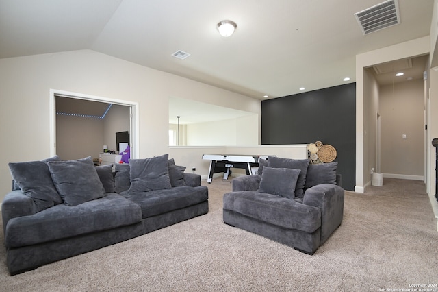 living room featuring light colored carpet and lofted ceiling