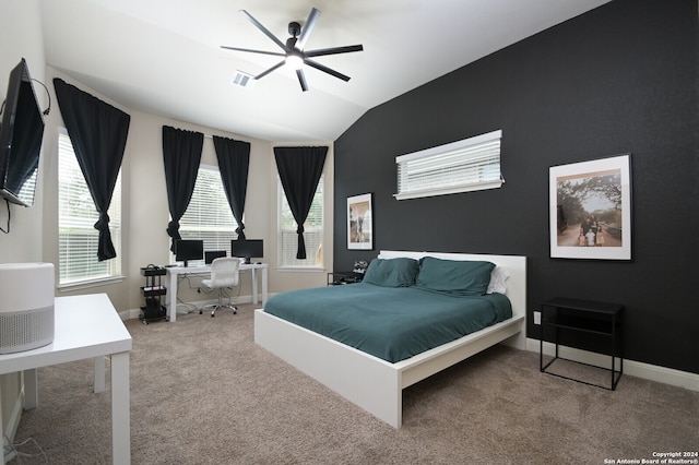 carpeted bedroom featuring ceiling fan and lofted ceiling