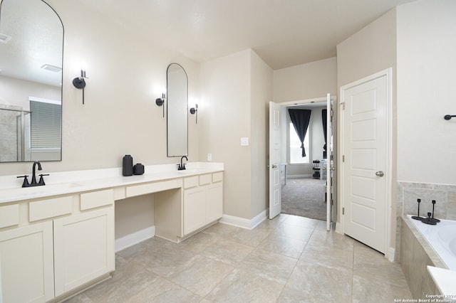 bathroom featuring tile patterned flooring, vanity, and shower with separate bathtub