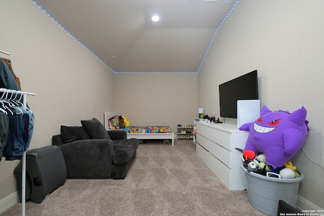 playroom featuring light colored carpet and vaulted ceiling