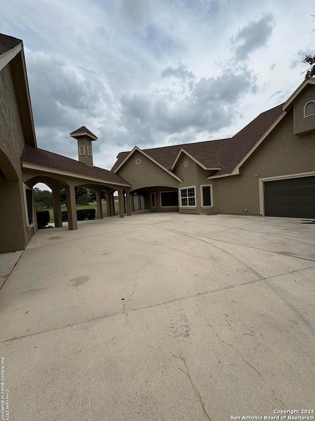 view of property exterior with a garage