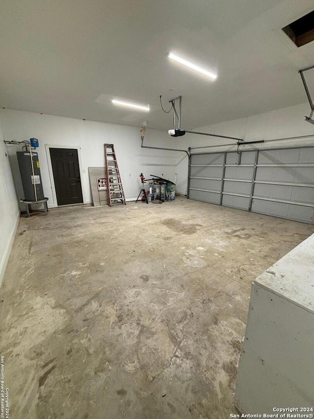 garage featuring gas water heater and a garage door opener