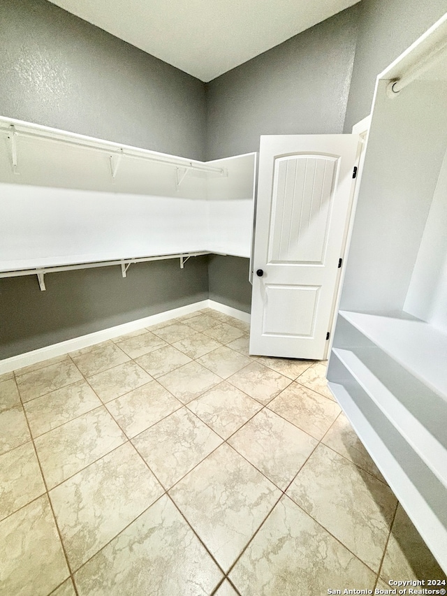 interior space with light tile patterned floors