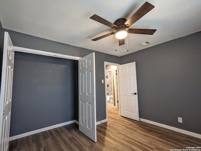 unfurnished bedroom with wood-type flooring, a closet, and ceiling fan