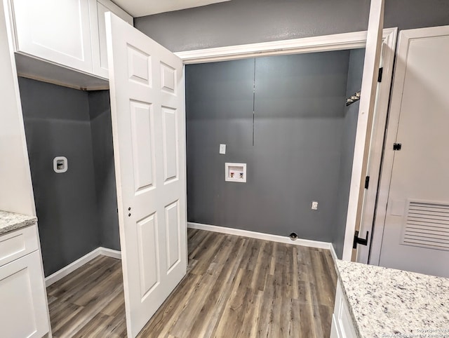 laundry room featuring cabinets, hookup for a washing machine, and hardwood / wood-style floors