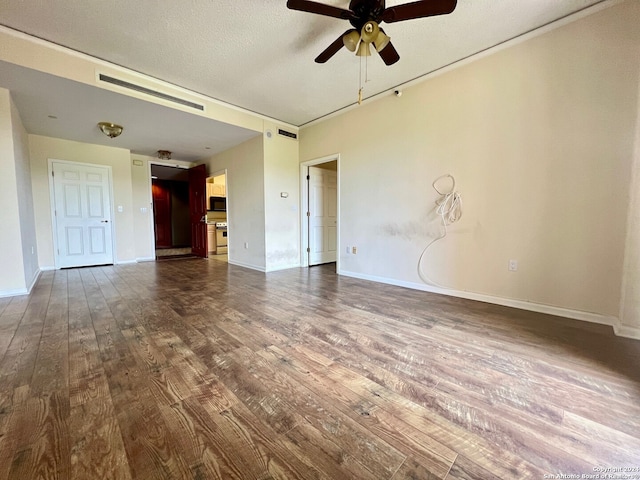 unfurnished room featuring a textured ceiling, ceiling fan, and dark hardwood / wood-style flooring