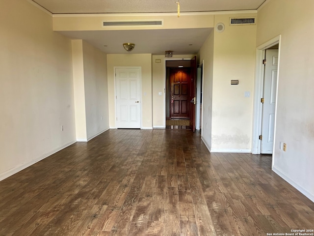 unfurnished room featuring dark wood-type flooring