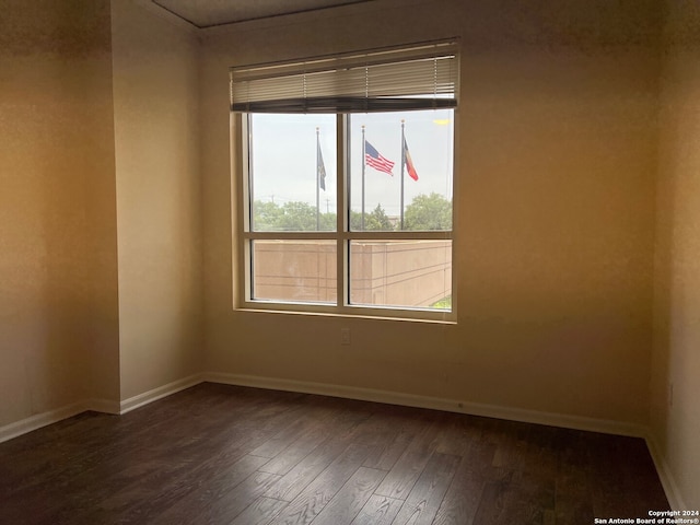 empty room with hardwood / wood-style floors