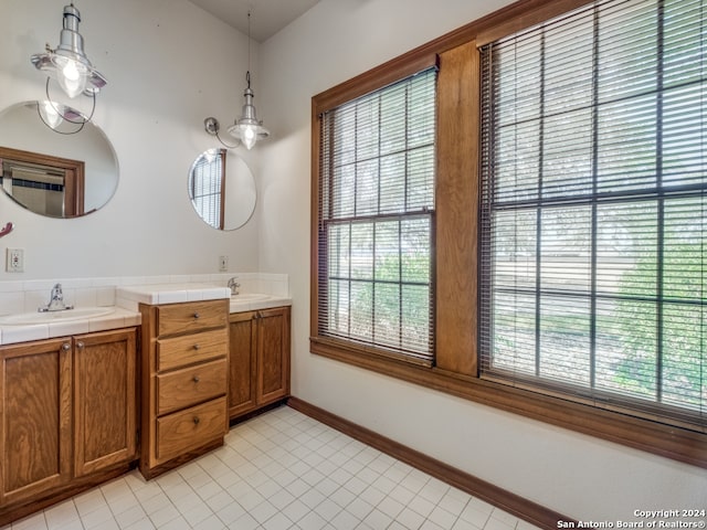 bathroom with tile flooring and dual vanity