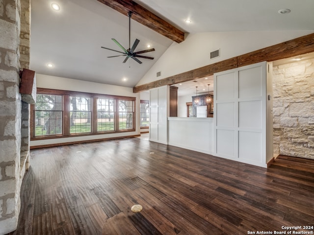 unfurnished living room with beam ceiling, dark hardwood / wood-style flooring, ceiling fan, and a fireplace