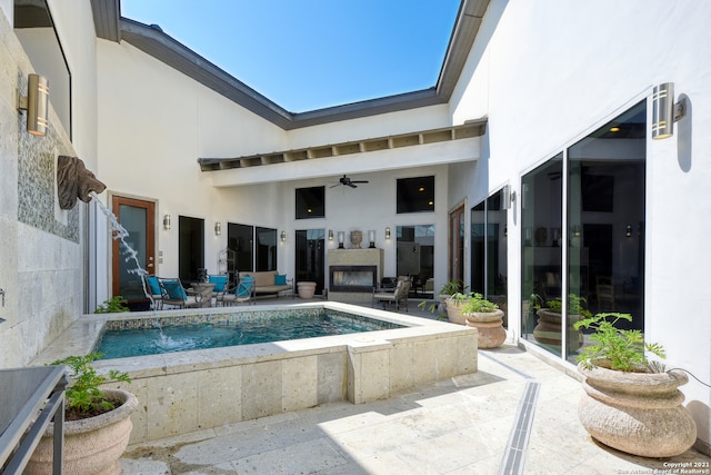 view of pool featuring a patio and ceiling fan