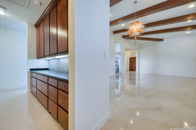 hallway with beam ceiling and light tile floors