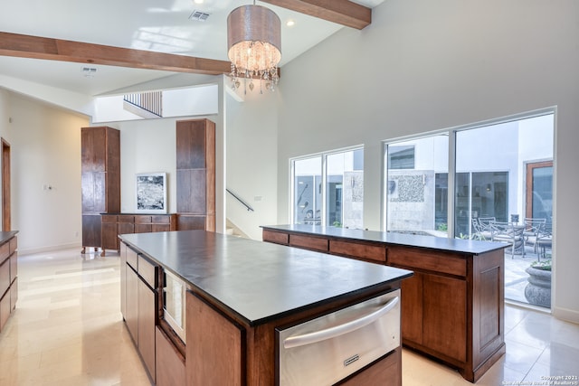 kitchen with a notable chandelier, hanging light fixtures, a center island, beam ceiling, and high vaulted ceiling