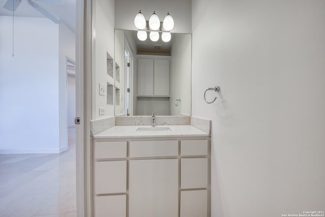 bathroom with tile flooring, vanity, and ceiling fan