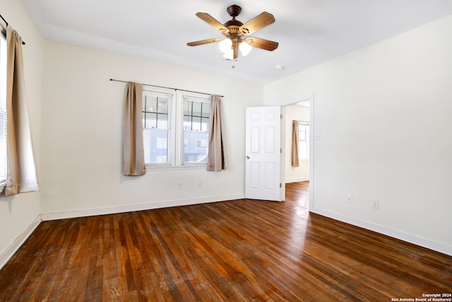 spare room featuring ceiling fan and hardwood / wood-style floors