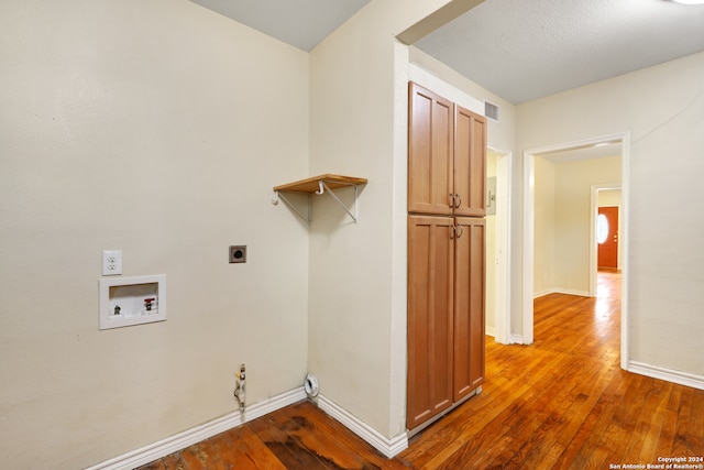 laundry room with hookup for an electric dryer, washer hookup, hardwood / wood-style flooring, and hookup for a gas dryer