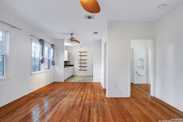 interior space with ceiling fan and light wood-type flooring