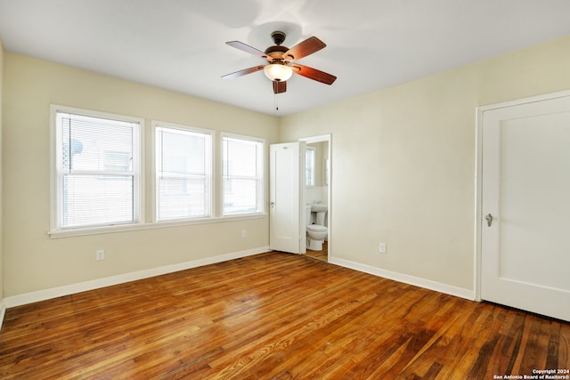 empty room featuring wood-type flooring and ceiling fan