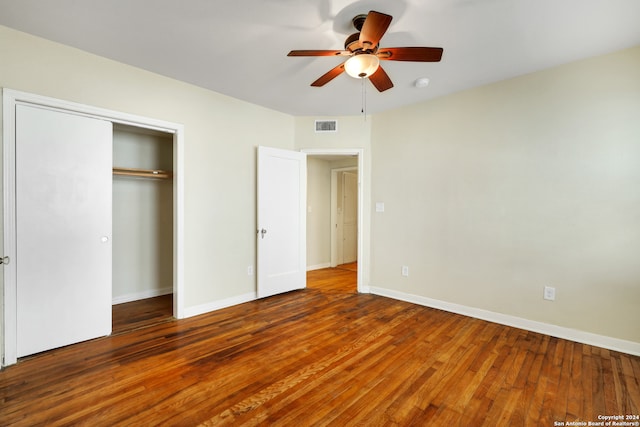 unfurnished bedroom with a closet, ceiling fan, and hardwood / wood-style floors