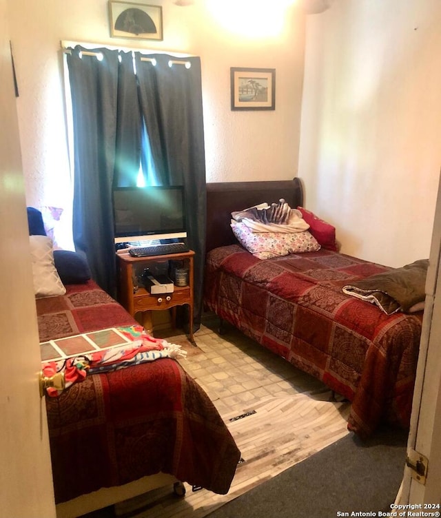 bedroom with wood-type flooring