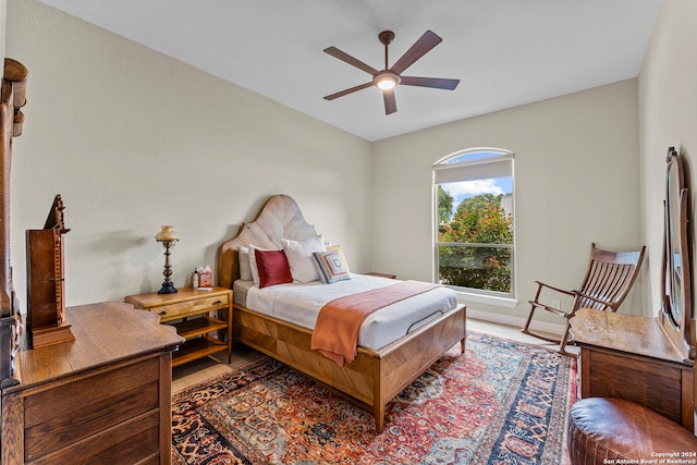 bedroom with hardwood / wood-style flooring and ceiling fan