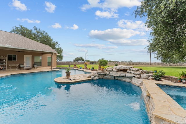 view of pool featuring ceiling fan, a patio area, and pool water feature