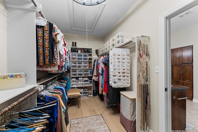 walk in closet featuring light hardwood / wood-style floors