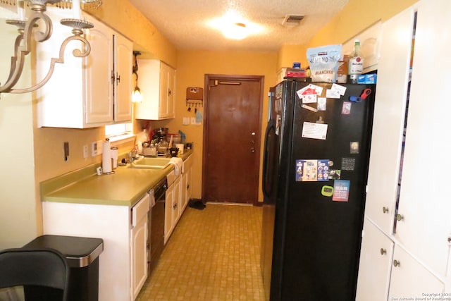 kitchen featuring black appliances, white cabinetry, sink, and a textured ceiling