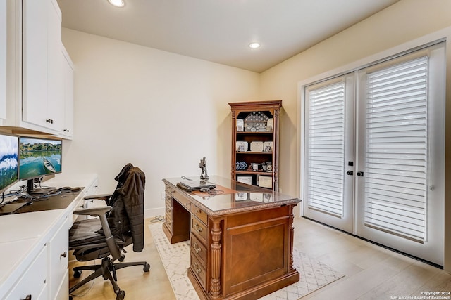 office with light hardwood / wood-style flooring