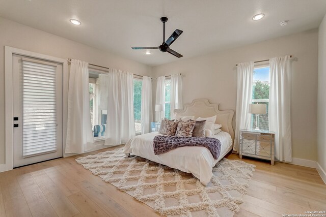 bedroom with access to exterior, ceiling fan, and light wood-type flooring