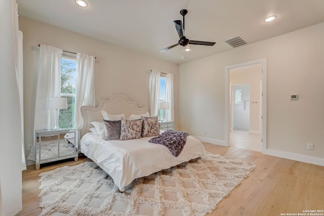 bedroom featuring ceiling fan and light hardwood / wood-style floors