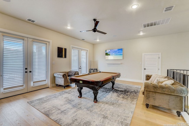 recreation room featuring light hardwood / wood-style floors, french doors, ceiling fan, and pool table