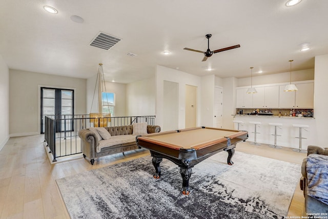 game room with light hardwood / wood-style floors, pool table, and ceiling fan