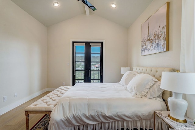 bedroom featuring vaulted ceiling with beams, hardwood / wood-style floors, french doors, and access to outside