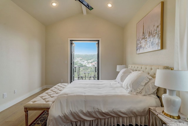 bedroom featuring wood-type flooring, vaulted ceiling with beams, and access to exterior