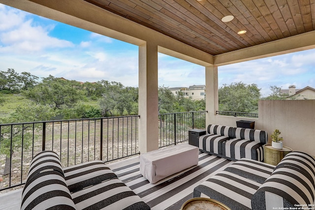 view of patio featuring a balcony