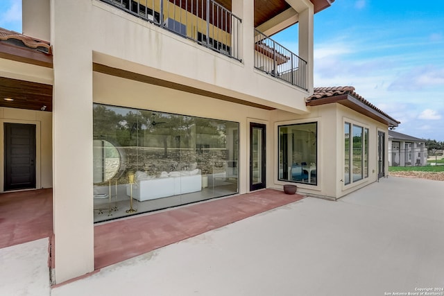 view of patio featuring a balcony